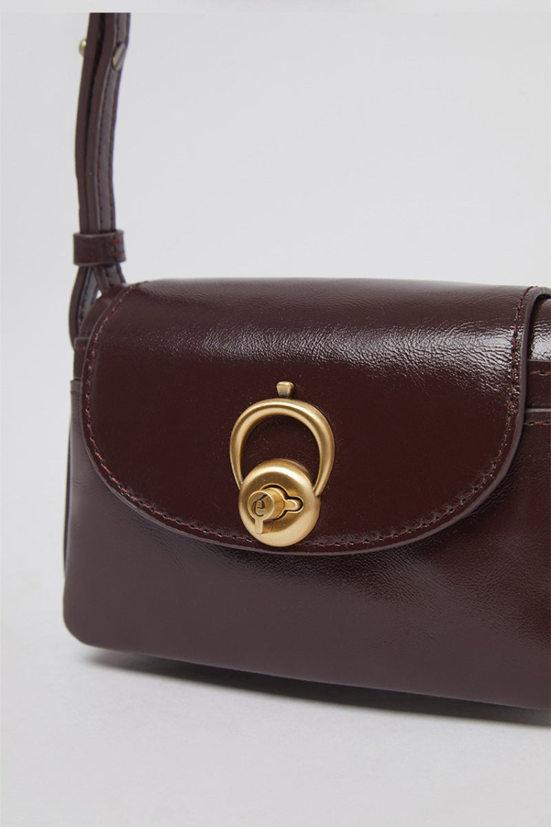 【WE ARE】Korea Archivepke Luv hole mini crossbody mini bag OVBRX24511