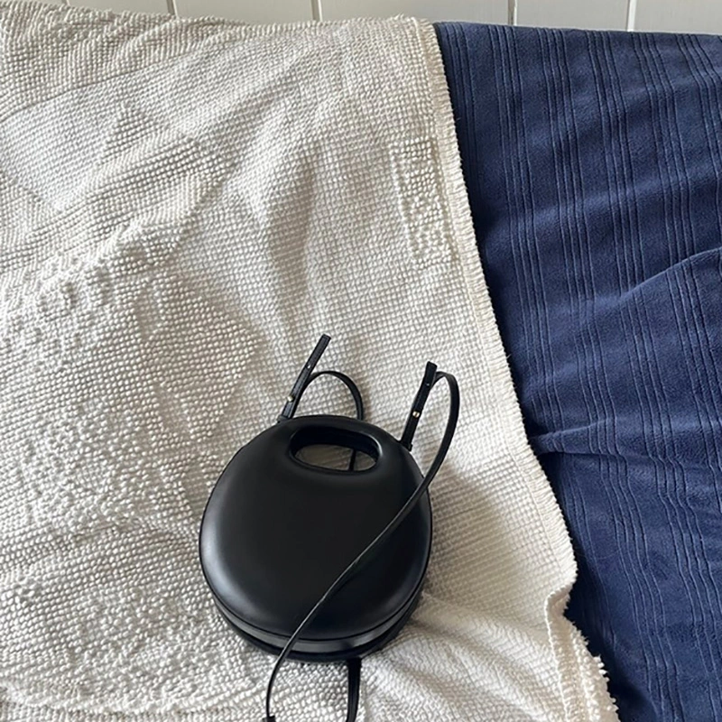 【WE ARE】Korea Archivepke Shell bagel bag OVBAX24016